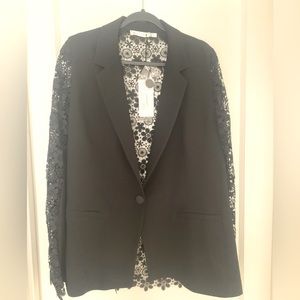 The cute black blazer and a special wardrobe piece. Paid $218 and never wore it.